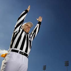 Referee signaling touchdown