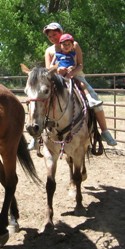 Woman and child on horse